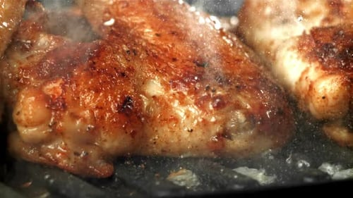 Chicken Wings are Fried in a Pan Filmed on a Highspeed Camera at 1000 Fps