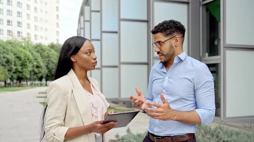 Video of diverse multiracial business people having conversation in financial district outdoors