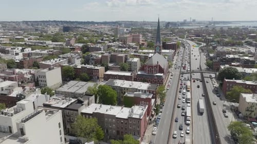 Traffic moves along the highway in Brooklyn near Cobble Hill
