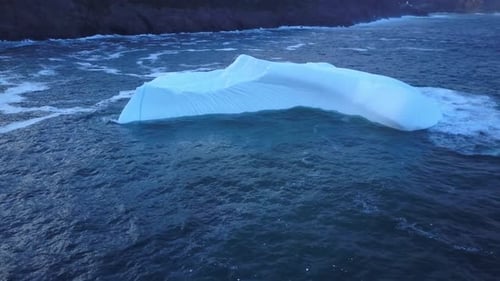 Iceberg floating near the coast