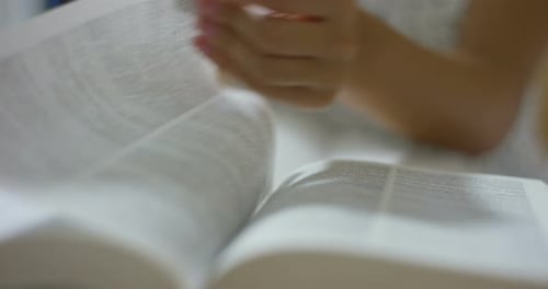 Close up of student is preparing for an exam with help of books and tablet. concept of connection