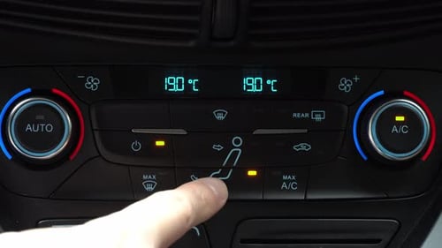 Finger turning off toggle switch of car air conditioner driver face and legs blow mode, two-phase