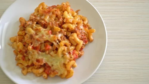 homemade baked macaroni bolognese with cheese - Italian food style