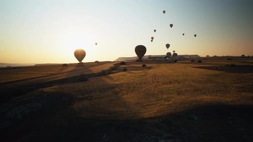 Aerial View of Cappadocia at Sunrise with Balloons