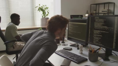 Guy Program Coding on Computer in Office