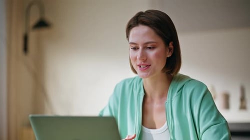 Woman Engaging in Video Call at Home
