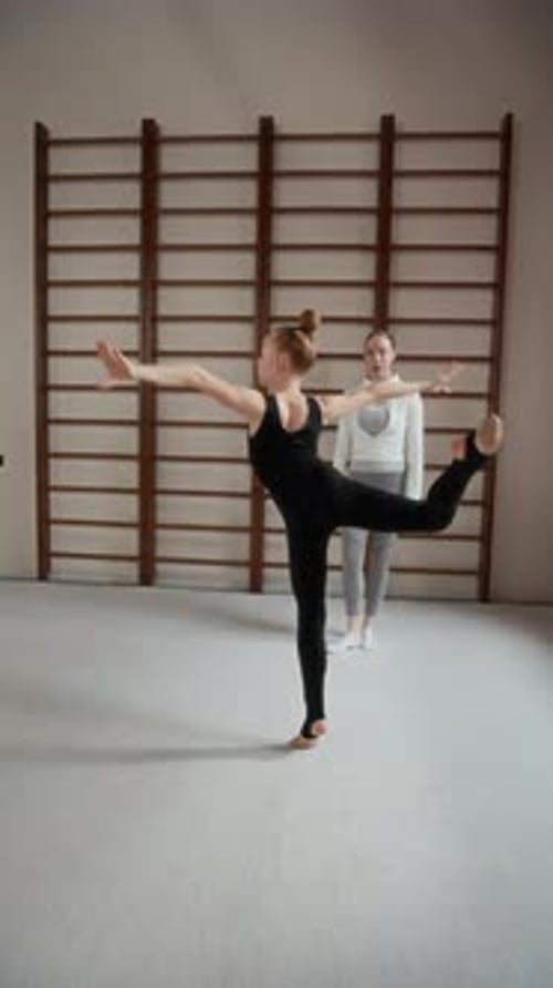 Gymnast Stretching During Training