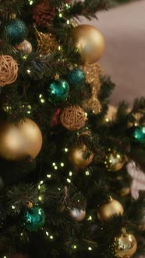Vertical of Christmas Tree with Glowing Lights and Gifts Beneath It