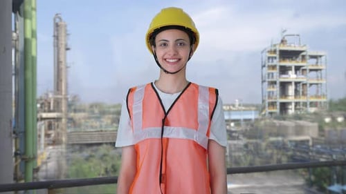Happy Indian female construction worker