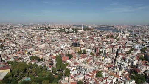 Istanbul, Turkey, Establishing Drone Shot of Hilltop Neighborhood With Iconic Mosques With Bosphorus