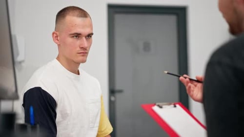 Close Up in a Modern Clinic in a Small Therapist s Office a Young Girl Doctor with a Stethoscope