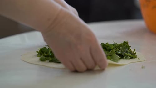 Preparing Dough with Leafy Greens for a Pastry