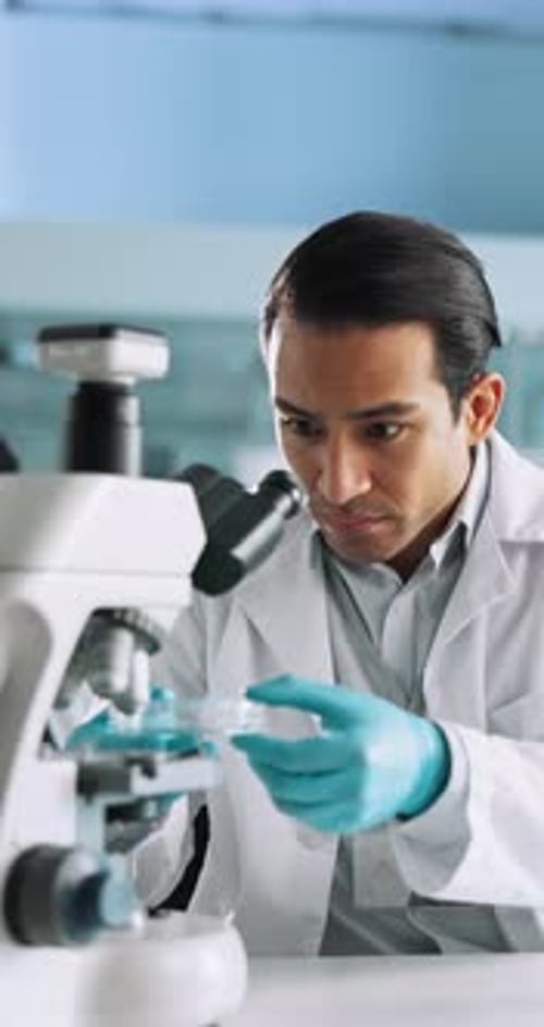 Science, laboratory and man with sample and microscope for research, medical analysis and chemistry