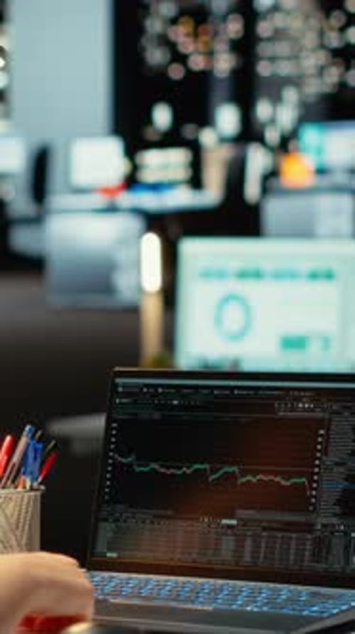 Stock market chart on laptop screen in office