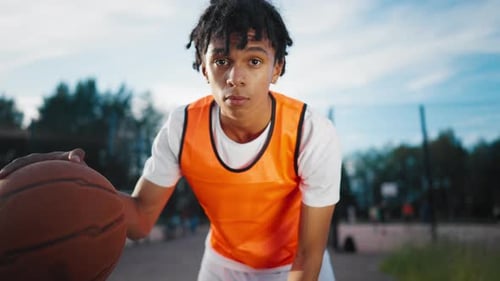 Sportive Teen Boy Playing with Ball on Streetball Court in Summer Do Sport Hobby and Healthy