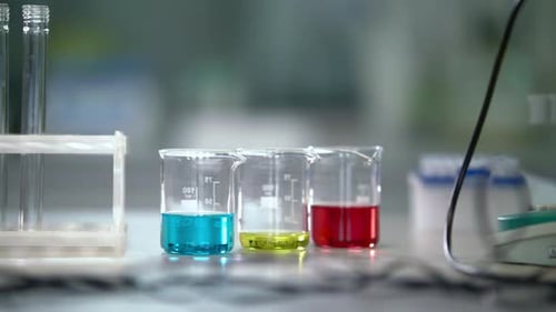 Laboratory Glassware in Chemical Lab. Panning on Measuring Cups and Lab Flasks