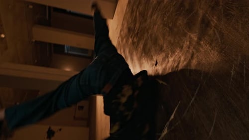 Young Man Breakdancing in an Empty Space