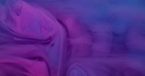 Abstract Pink and Blue Inks Flowing Together