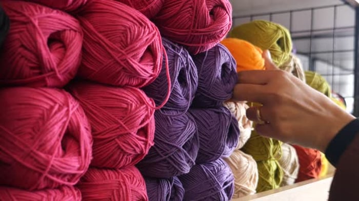 Close up of a hand touching raw, warm and soft wool. Concept of ...