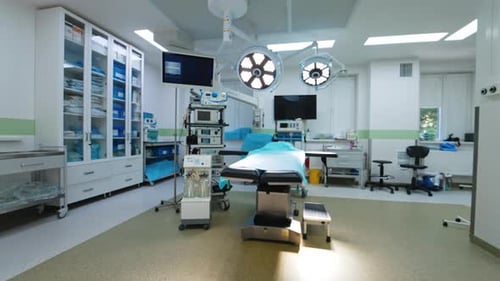 Overlooking a spacious light surgery room in modern hospital. Well-equipped ward for neurosurgeries.