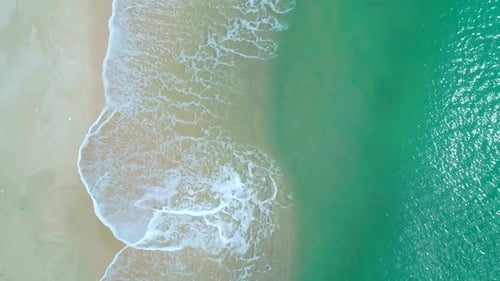 Aerial View of Sandy Beach and Turquoise Ocean Top View of Ocean Waves Reaching Shore on Sunny Day