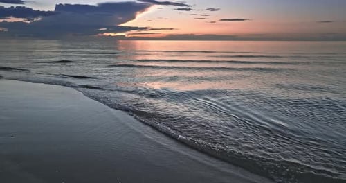 Calm golden sunset over Batlic sea in summer.