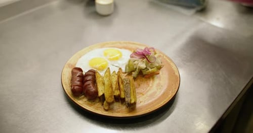 Plating Breakfast with Eggs, Sausages, and Red Onion
