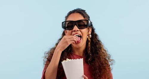 Woman, 3d glasses and laugh with popcorn in studio, comedy movie or joke by blue background