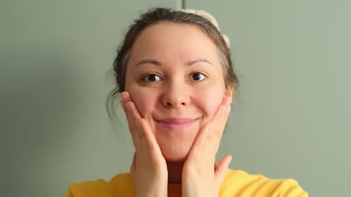Woman Massaging Face for Beauty and Wellness