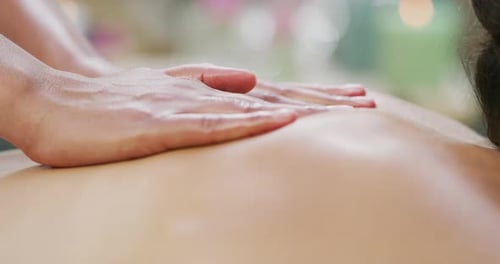 Woman Receives a Relaxing Back and Neck Massage