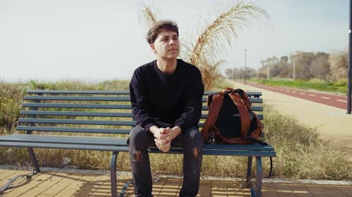 Man On The Bench In The Nature Feeling The Air Breeze And Relaxing