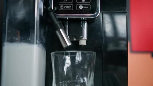 Espresso Machine Dispensing Coffee into Glass
