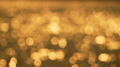 Golden Shimmering Bokeh Lights Abstract Background