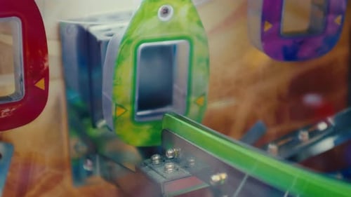 One coin successfully enter the slot while another fail on coin arcade in the game area amusement pa