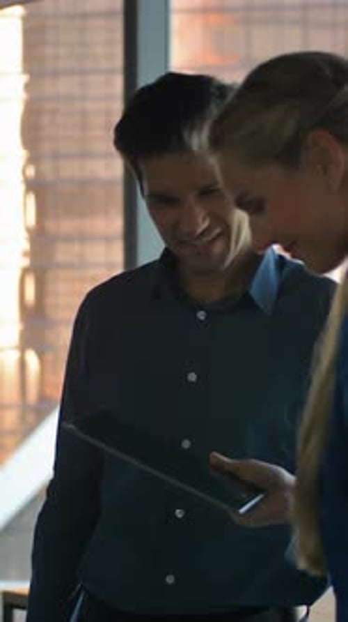 Colleagues Reviewing Tablet in Office