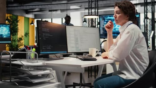Cheerful Technician Working in Office Using AI Specialized Hardware