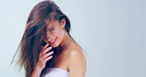 Smiling Woman with Long Brown Hair Posing