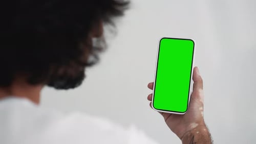 Young Person Use Smartphone with Green Screen Chroma Key Closeup