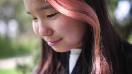 Teen Girl Crying and Wiping Tears Away