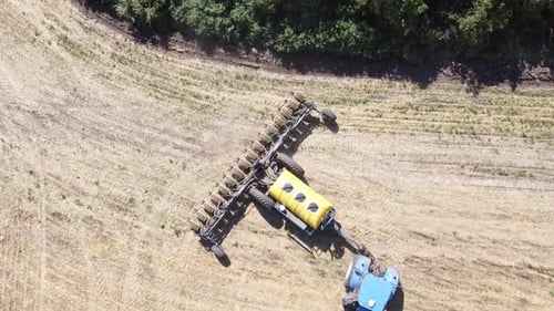 Blue Tractor O.A. Planting Canola On No Till Field