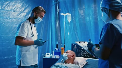 Doctors and Covid-19 Infected Patient in Bed in Hospital, Coronavirus Concept