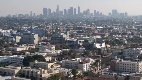 Los Angeles, California city skyline - push in aerial view on a smoggy day