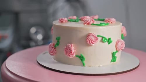 Elegant Rotating Cakepink Buttercream Flowers on White Frosting Bakery Pastry