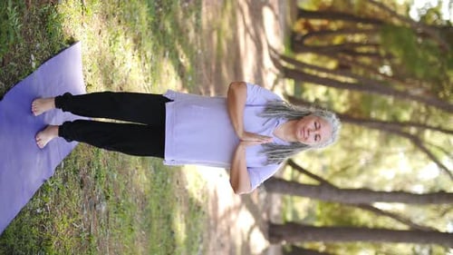Senior Woman Practicing Yoga in Nature