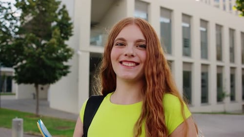 Confident University Student Walking on Campus with Books