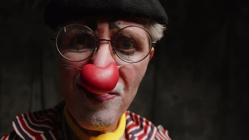Close Up of Clown with Red Nose and Makeup