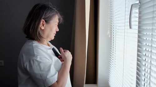 Elderly Woman Expressing Sadness and Anxiety at Home