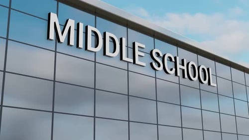 Airplane Passing Over a Middle School Building