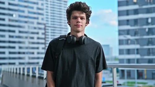 Portrait of College University Student Guy Looking at Camera Outdoor Urban Style