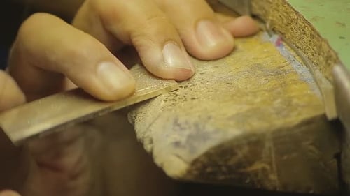 Italian Goldsmith at work building an engagement or a wedding ring.